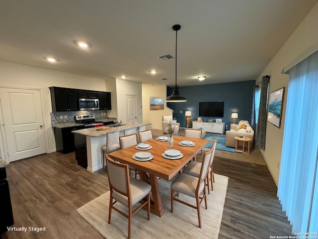 dining space featuring dark hardwood / wood-style floors