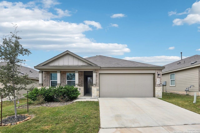 view of front of house with a front lawn and a garage