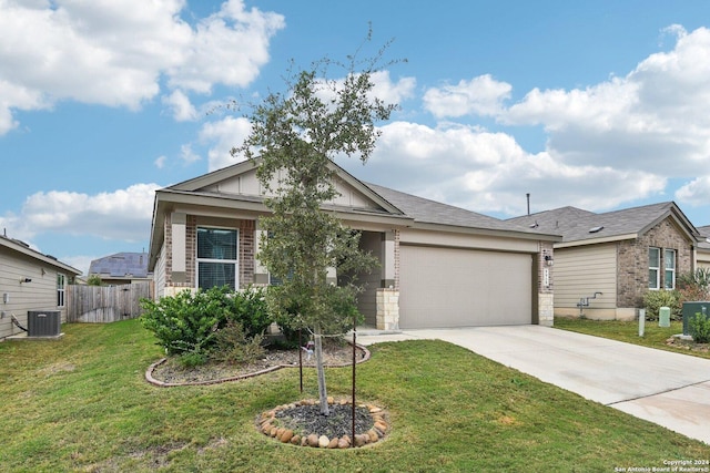 ranch-style house with central air condition unit, a front lawn, and a garage