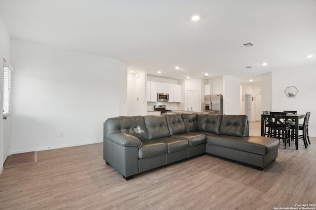 living room with light hardwood / wood-style floors