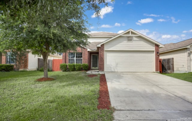 view of front facade with a front yard and a garage