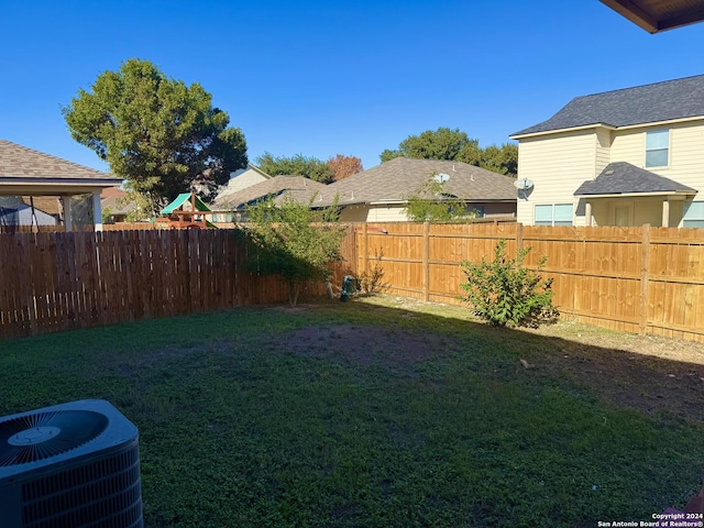 view of yard featuring central AC unit