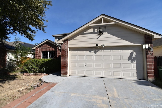 ranch-style home with a garage