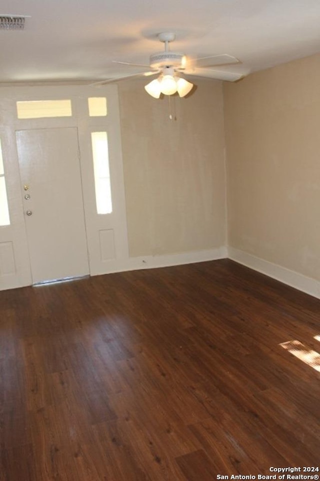 foyer entrance with dark hardwood / wood-style floors and ceiling fan