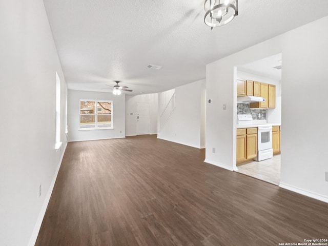 unfurnished living room with ceiling fan, light hardwood / wood-style floors, and a textured ceiling