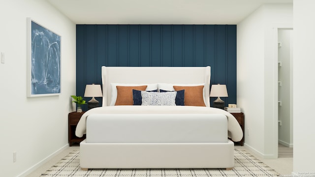 bedroom with wood walls and light colored carpet