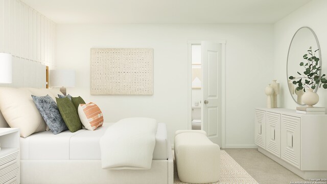 bedroom with ensuite bath and light colored carpet