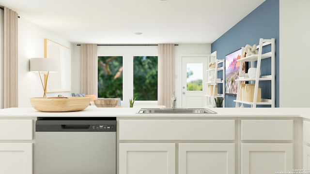 kitchen with dishwasher, white cabinets, and sink