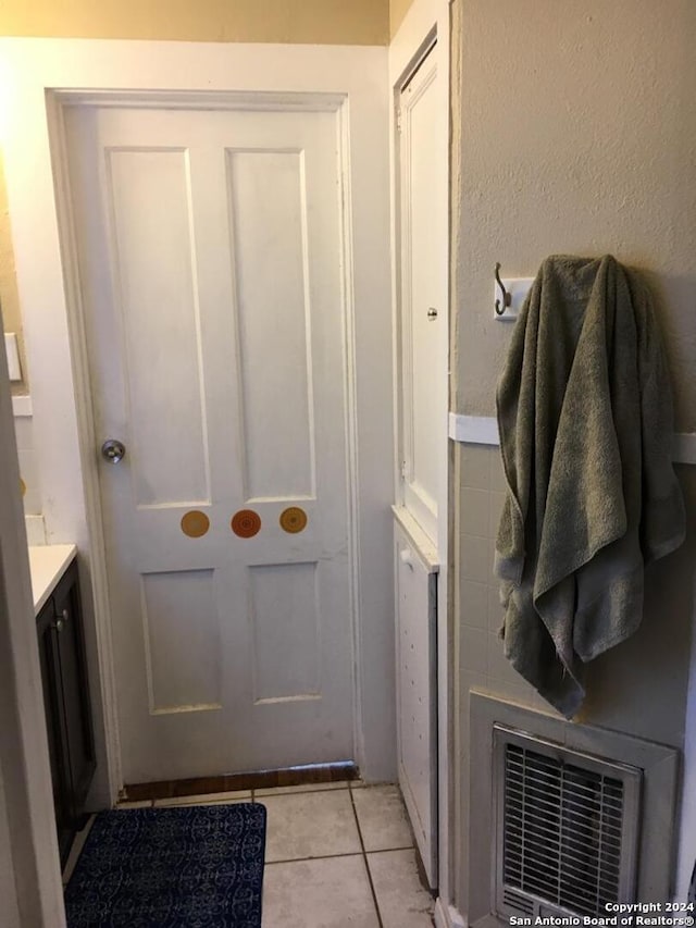 bathroom featuring tile patterned floors and vanity