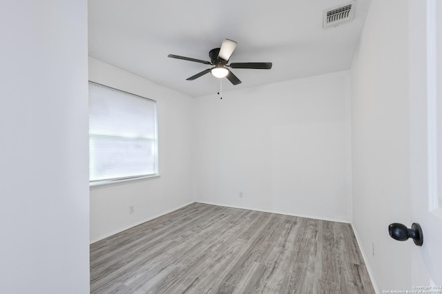 spare room with ceiling fan and light hardwood / wood-style floors