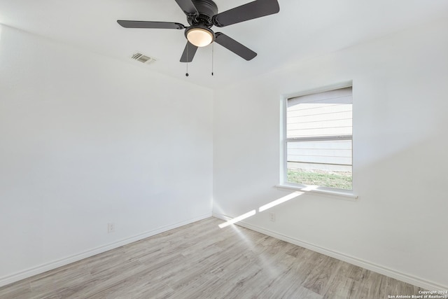 unfurnished room featuring ceiling fan and light wood-type flooring