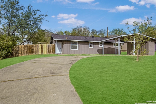 view of front of house with a front yard and fence