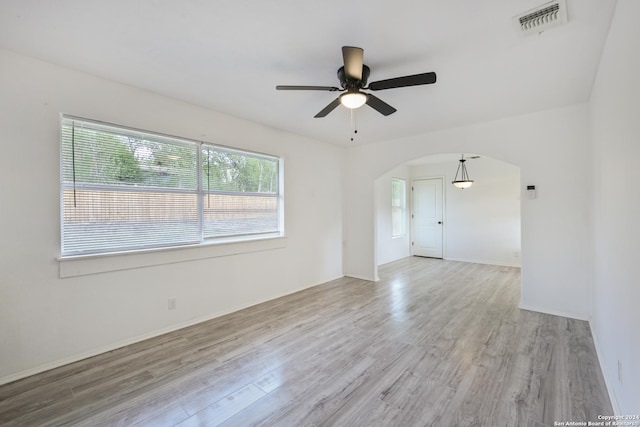 unfurnished room featuring ceiling fan and light hardwood / wood-style flooring