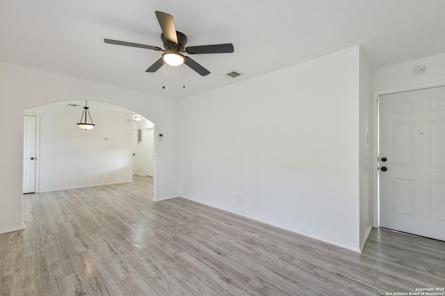 unfurnished room featuring ceiling fan and light hardwood / wood-style flooring