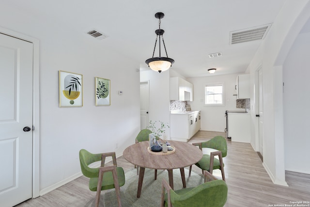 dining area featuring light wood-type flooring