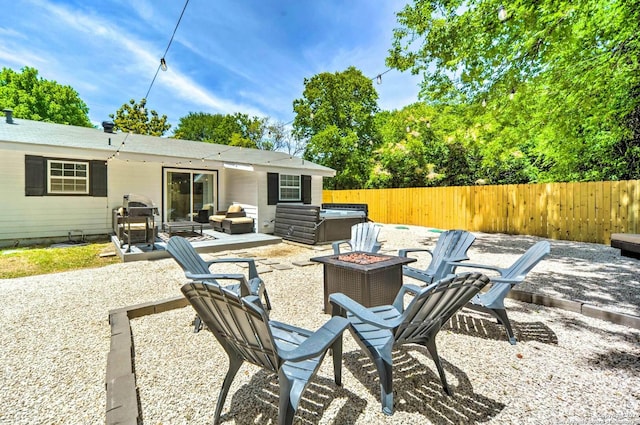 view of patio / terrace with an outdoor fire pit