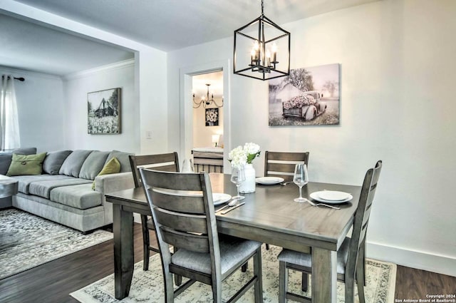 dining space with a notable chandelier, crown molding, and dark wood-type flooring