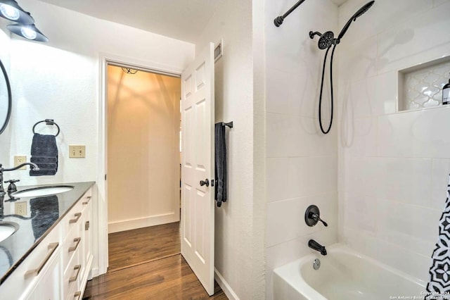 bathroom featuring vanity, wood-type flooring, and shower / tub combo with curtain