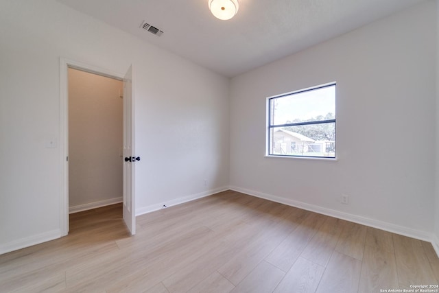 spare room featuring light hardwood / wood-style flooring