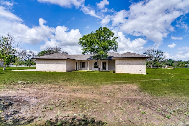 ranch-style house with a front lawn