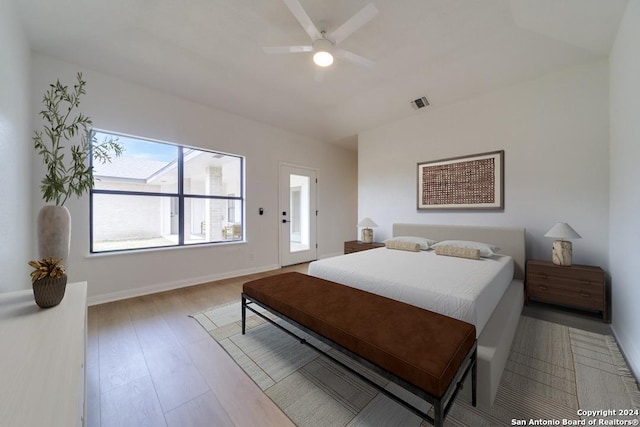 bedroom with light hardwood / wood-style flooring and ceiling fan