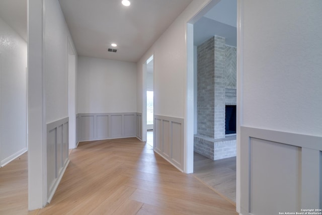 corridor featuring light hardwood / wood-style floors