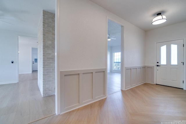 entrance foyer with light wood-type flooring and ceiling fan