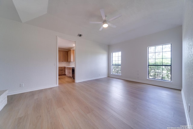 unfurnished room with ceiling fan and light hardwood / wood-style flooring