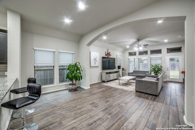 living room with ceiling fan and hardwood / wood-style flooring