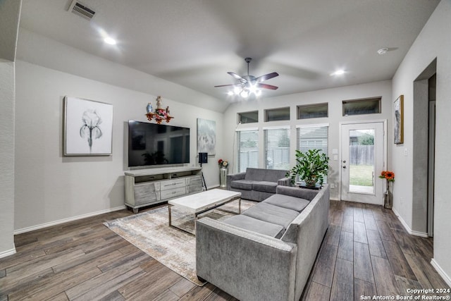 living room featuring dark hardwood / wood-style floors and ceiling fan