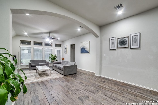 living room with ceiling fan and wood-type flooring