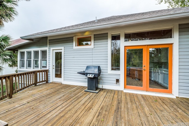 wooden terrace featuring grilling area