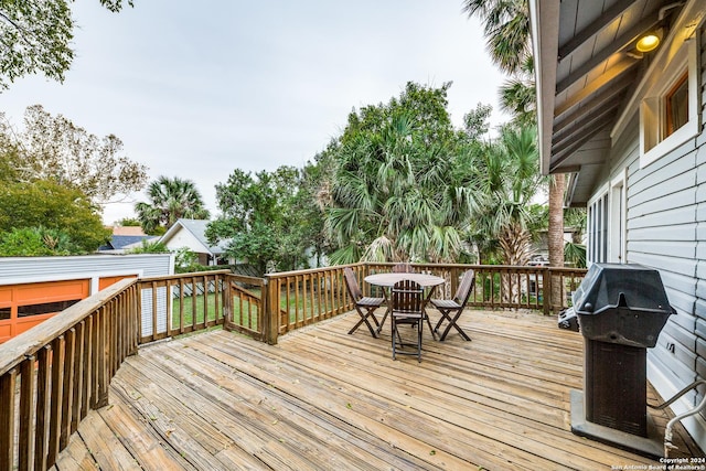 wooden terrace featuring grilling area