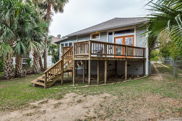 rear view of house with a wooden deck