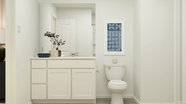 bathroom with hardwood / wood-style floors, vanity, and toilet