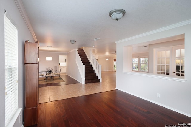 interior space featuring hardwood / wood-style floors and crown molding