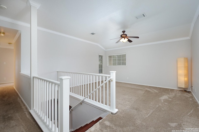 corridor featuring carpet floors, vaulted ceiling, and crown molding