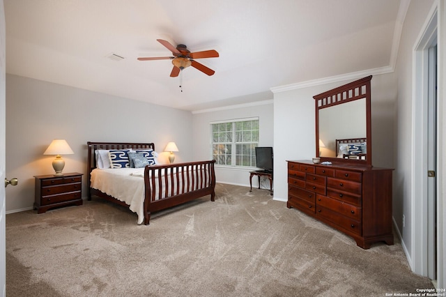 carpeted bedroom featuring ceiling fan and ornamental molding