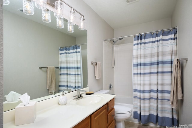 full bathroom featuring shower / bathtub combination with curtain, vanity, and toilet