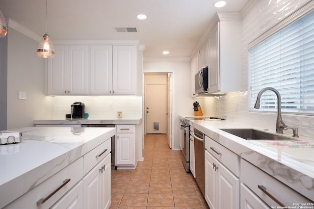 kitchen with white cabinetry, sink, and stainless steel appliances