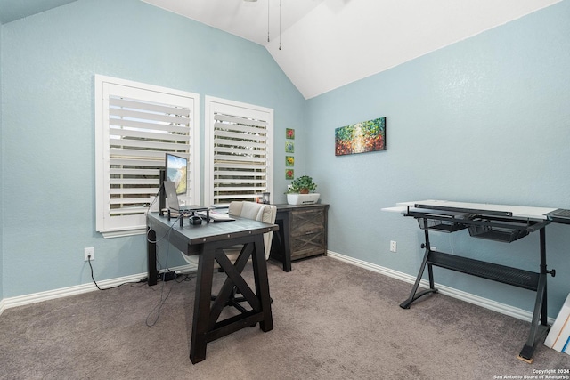 carpeted office space with vaulted ceiling