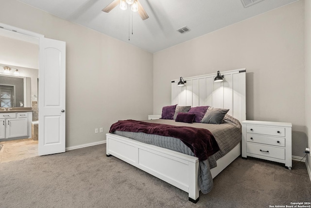 carpeted bedroom featuring connected bathroom and ceiling fan