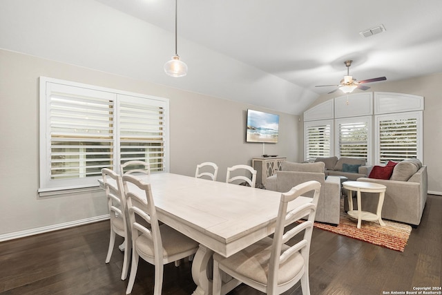 dining space featuring ceiling fan, dark hardwood / wood-style flooring, and lofted ceiling