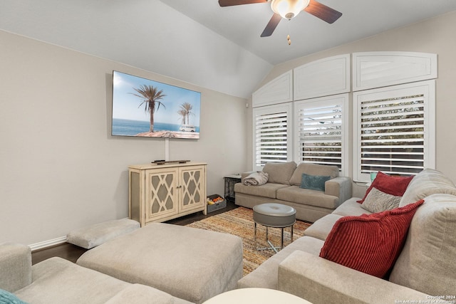 living room with ceiling fan, wood-type flooring, and lofted ceiling