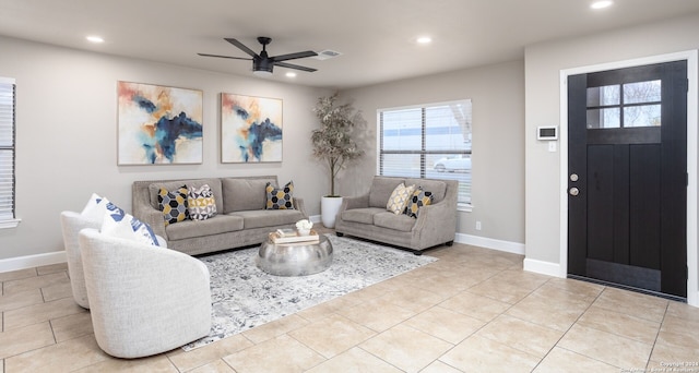 tiled living room with ceiling fan