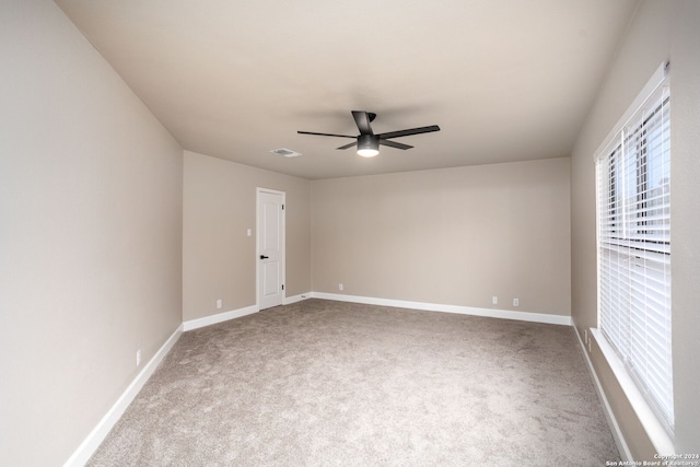 unfurnished room featuring carpet and ceiling fan