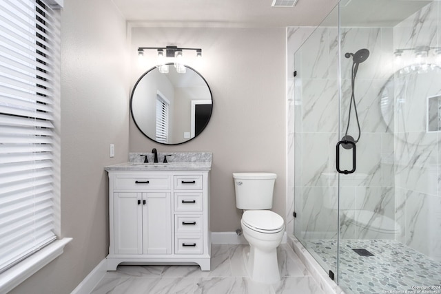 bathroom with vanity, toilet, and an enclosed shower