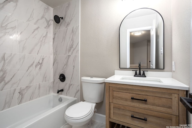 full bathroom with vanity, toilet, and tiled shower / bath combo