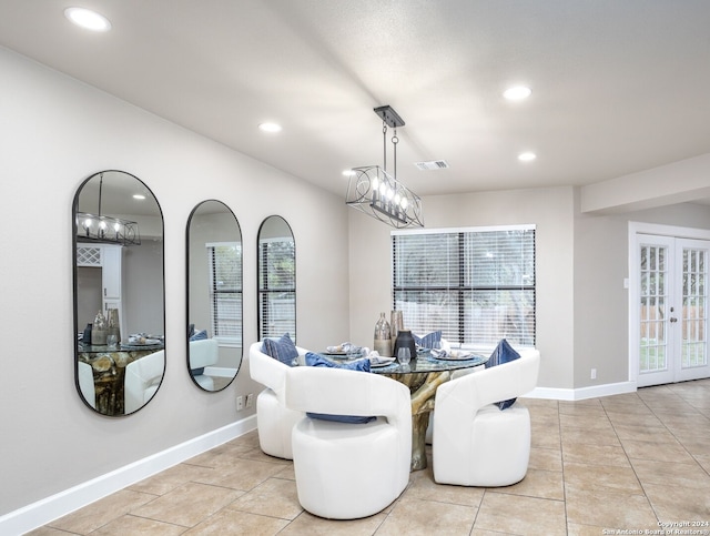 dining room with french doors and light tile patterned flooring