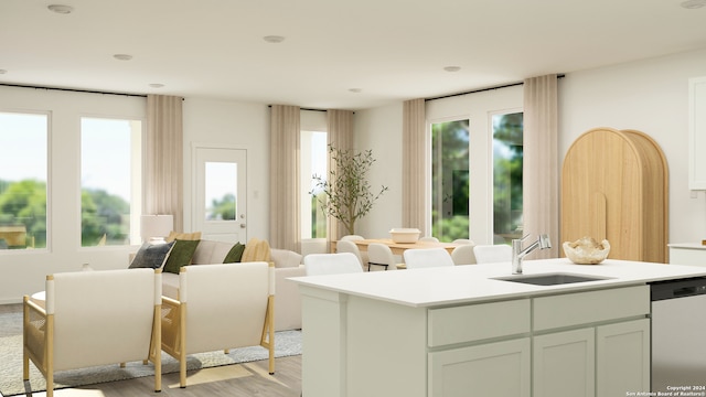 sitting room with sink and light hardwood / wood-style flooring